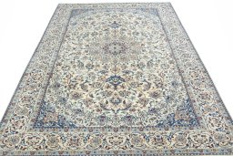 Surface texture of 2000s Nain rug with natural Wool and intricate pattern