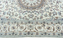 Corner detail of New Nain rug showing border pattern and Wool pile