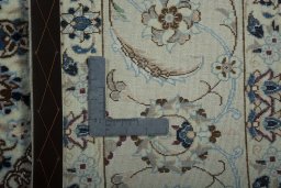 Backside of handmade New Nain rug showing knot structure and weave density