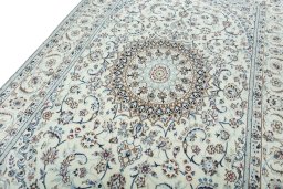 Backside of handmade New Nain rug showing knot structure and weave density