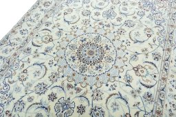 Backside of handmade New Nain rug showing knot structure and weave density