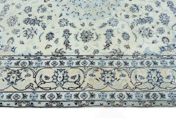 Corner detail of New Nain rug showing border pattern and Wool pile