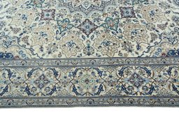Corner detail of 2000s Nain rug showing border pattern and Wool pile