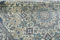 Close-up detail of 2000s Nain rug from Iran / Persia showing Wool weave