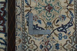 Backside of handmade 2000s Nain rug showing knot structure and weave density