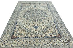 Surface texture of 2000s Nain rug with natural Wool and intricate pattern