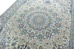 Backside of handmade 2000s Nain rug showing knot structure and weave density