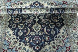 Close-up detail of 2000s Nain rug from Iran / Persia showing Wool weave