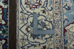Backside of handmade 2000s Nain rug showing knot structure and weave density