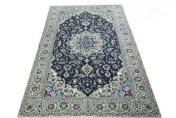 Surface texture of 2000s Nain rug with natural Wool and intricate pattern