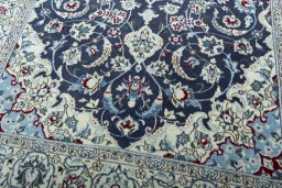 Close-up detail of 2000s Nain rug from Iran / Persia showing Wool weave