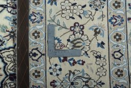 Backside of handmade 2000s Nain rug showing knot structure and weave density