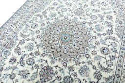 Backside of handmade 2000s Nain rug showing knot structure and weave density