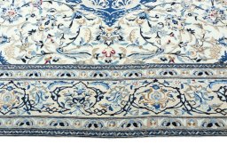 Corner detail of 2000s Nain rug showing border pattern and Wool pile