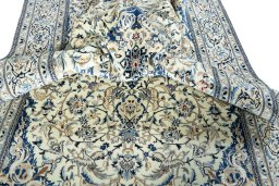 Surface texture of 2000s Nain rug with natural Wool and intricate pattern