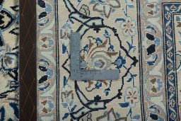 Backside of handmade 2000s Nain rug showing knot structure and weave density