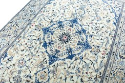 Backside of handmade 2000s Nain rug showing knot structure and weave density