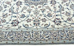 Corner detail of 2000s Nain rug showing border pattern and Wool pile
