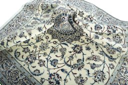 Surface texture of 2000s Nain rug with natural Wool and intricate pattern