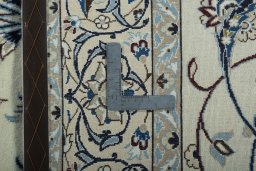 Backside of handmade 2000s Nain rug showing knot structure and weave density