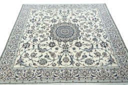 Surface texture of 2000s Nain rug with natural Wool and intricate pattern