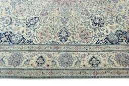 Corner detail of 1970s Nain rug showing border pattern and Wool pile