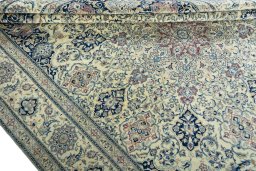 Close-up detail of 1970s Nain rug from Iran / Persia showing Wool weave