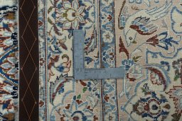 Backside of handmade 2000s Nain rug showing knot structure and weave density