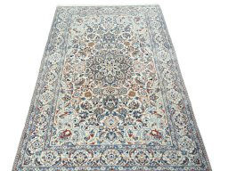 Surface texture of 2000s Nain rug with natural Wool and intricate pattern