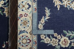 Close-up detail of 2000s Nain rug from Iran / Persia showing Wool weave