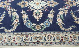 Close-up detail of 2000s Nain rug from Iran / Persia showing Wool weave