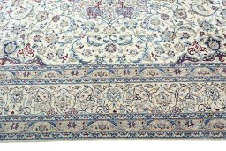 Corner detail of 2000s Nain rug showing border pattern and Wool pile