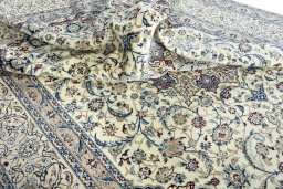 Surface texture of 2000s Nain rug with natural Wool and intricate pattern