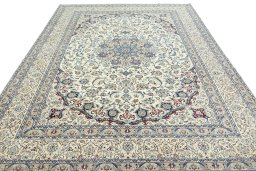 Surface texture of 2000s Nain rug with natural Wool and intricate pattern