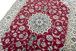 Backside of handmade New Nain rug showing knot structure and weave density