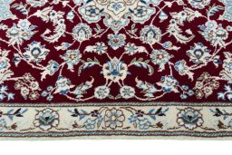 Corner detail of New Nain rug showing border pattern and Wool pile