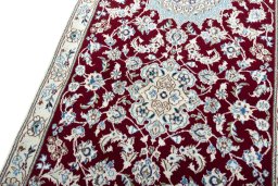 Backside of handmade New Nain rug showing knot structure and weave density