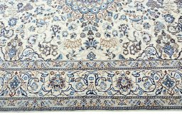Corner detail of New Nain rug showing border pattern and Wool pile
