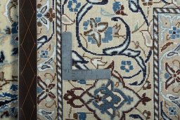 Backside of handmade New Nain rug showing knot structure and weave density