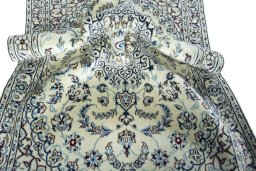 Surface texture of 2000s Nain rug with natural Wool and intricate pattern