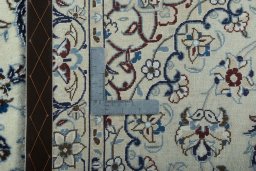 Backside of handmade 2000s Nain rug showing knot structure and weave density