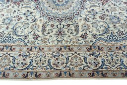 Corner detail of 2000s Nain rug showing border pattern and Wool pile