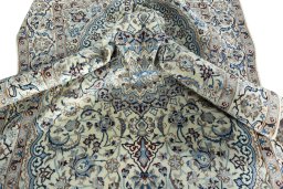 Surface texture of 2000s Nain rug with natural Wool and intricate pattern