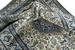 Surface texture of 2000s Nain rug with natural Wool and intricate pattern