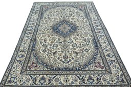 Surface texture of 2000s Nain rug with natural Wool and intricate pattern