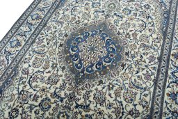 Backside of handmade 2000s Nain rug showing knot structure and weave density