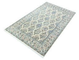 Corner detail of New Nain rug showing border pattern and Cork pile