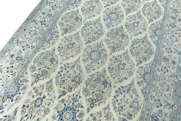 Backside of handmade New Nain rug showing knot structure and weave density