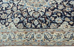 Corner detail of 2000s Nain rug showing border pattern and Wool pile