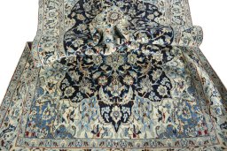Surface texture of 2000s Nain rug with natural Wool and intricate pattern